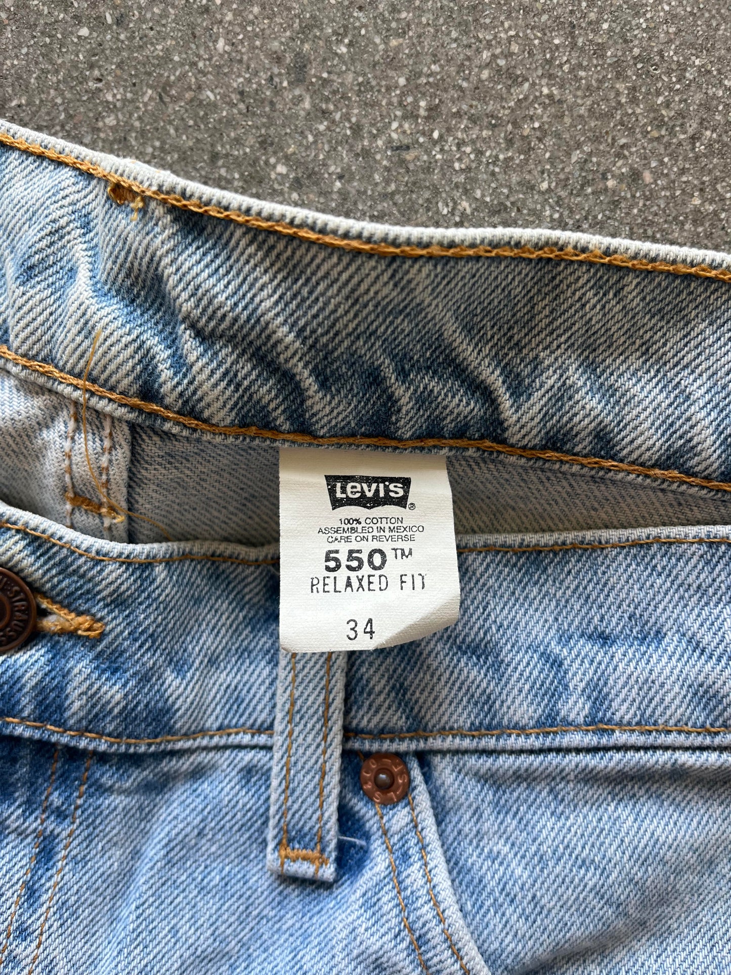 90'S ORANGE TAB LEVI'S 550 JORTS - 34