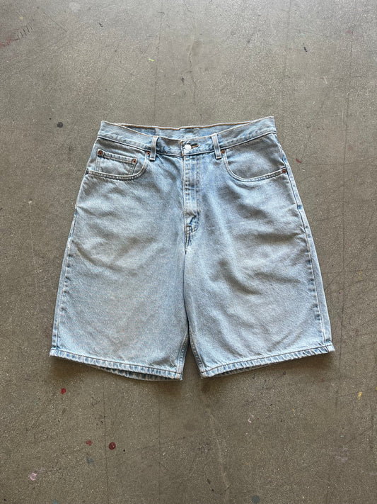 90’S LIGHTWASHED LEVI’S 560 JORTS - 33