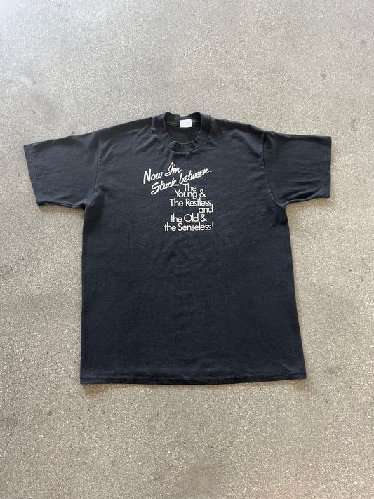 90’S “NOW I’M STUCK BETWEEN…” TEE - L